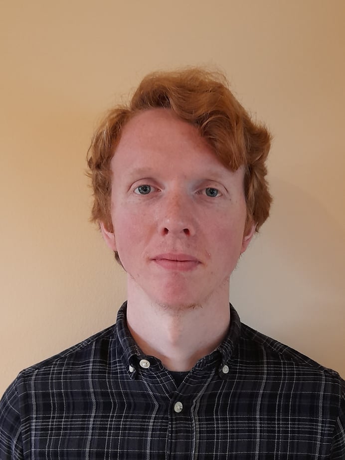 portrait of young male with short red hair