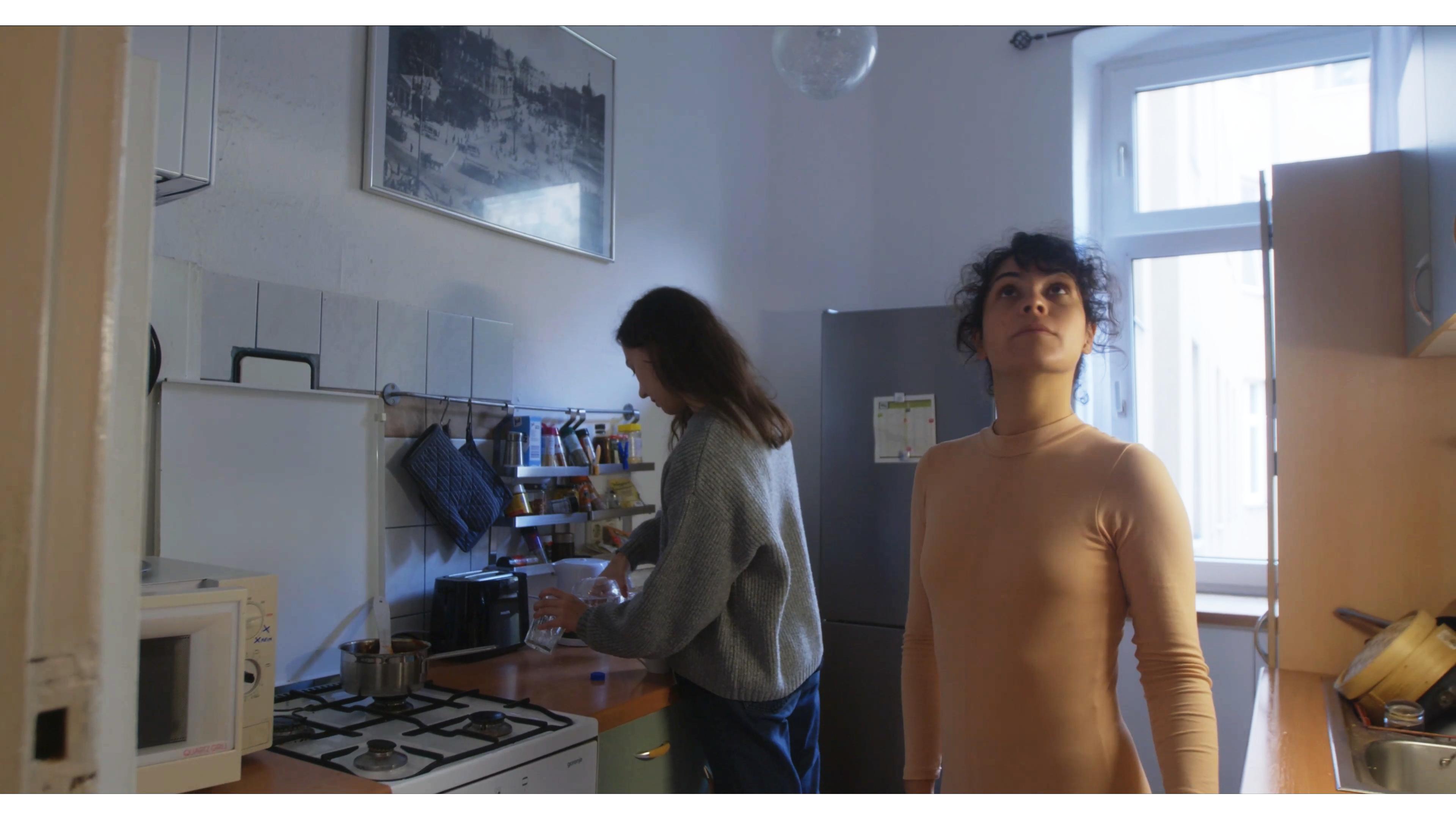 still image from the short firlm, 2 women pictured in a kitchen